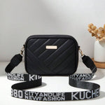 Black leather crossbody bag with adjustable strap - side view